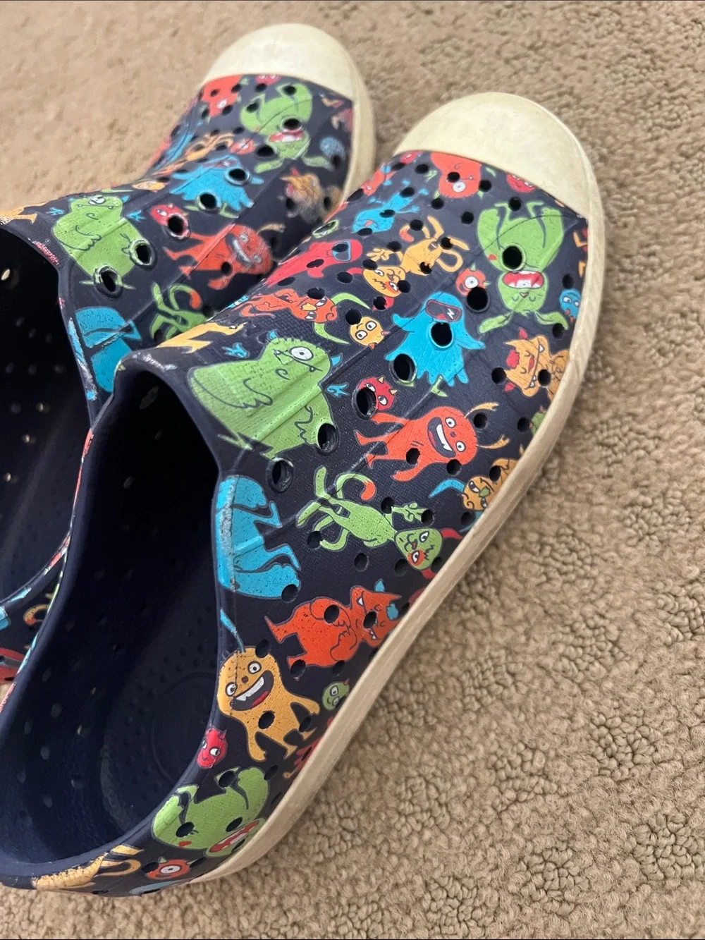 Native Kids Slip-On Shoes in Black with Multicolor Monster Print